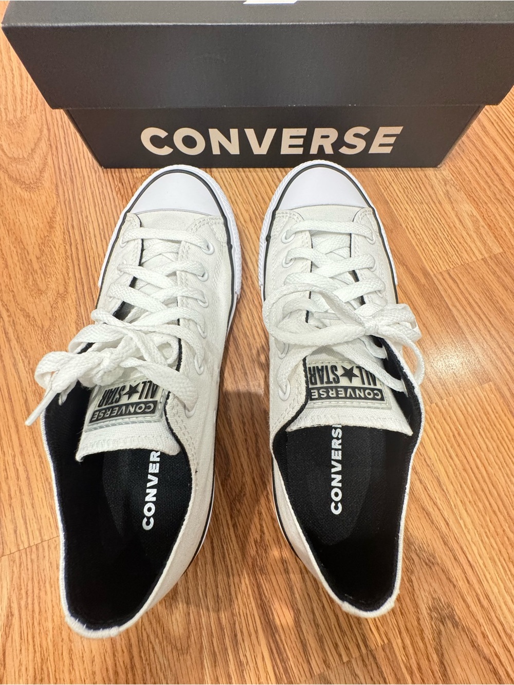 Converse Low Top Canvas Sneakers in White and Black Trim